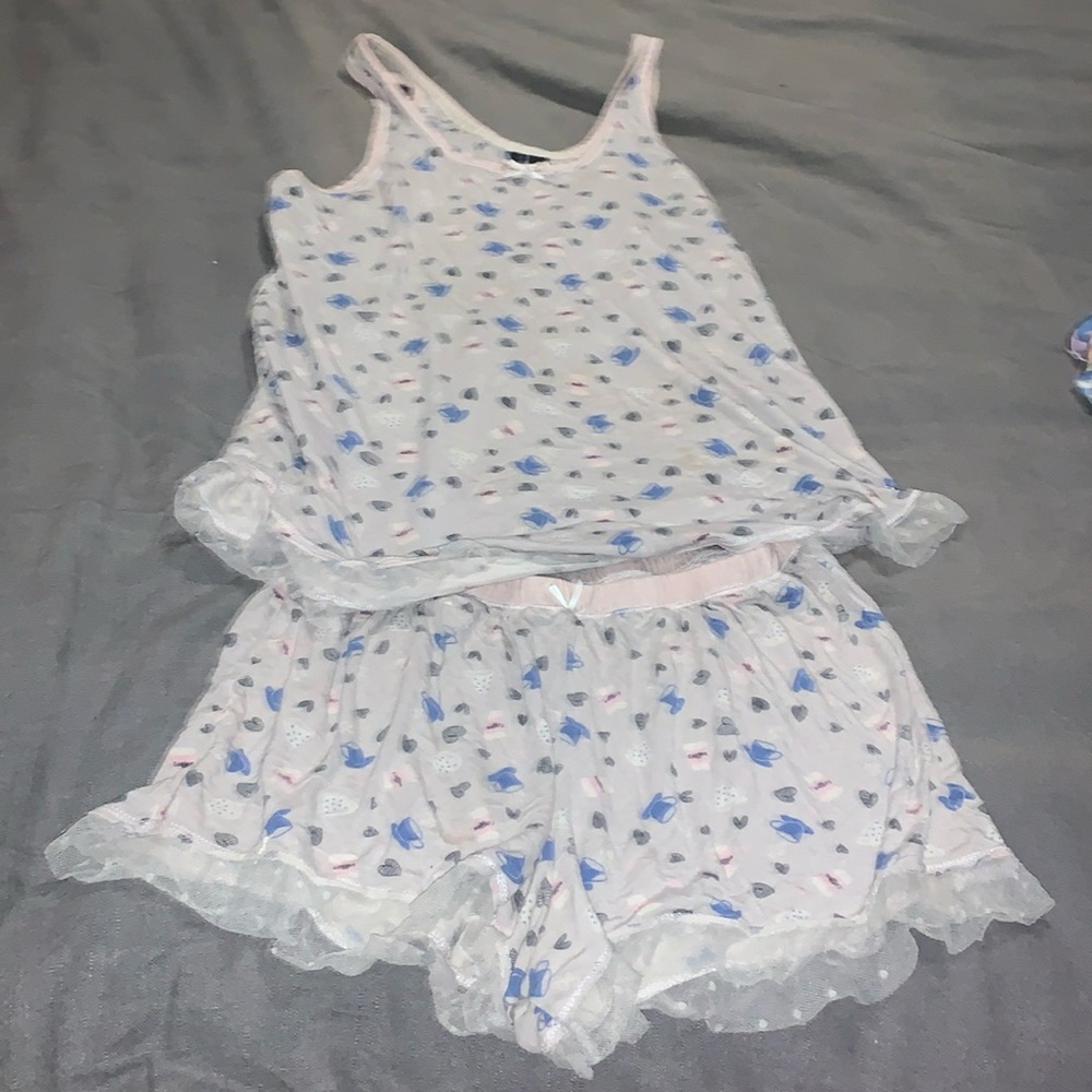 Blue coffee, cups, and black hearts with frizzes at the bottom of the shorts